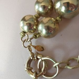 LEE ANGEL NECKLACE GOLD BALLS WITH RHINESTONES IT IS KNOTTED BETWEEN EACH BAL